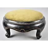 A Late Victorian Ebonised Circular Footstool with Scrolled Feet, 34cm Diameter
