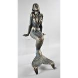 A Heavy Cast Metal Figure of a Seated Mermaid, 38cm high (Plus VAT)