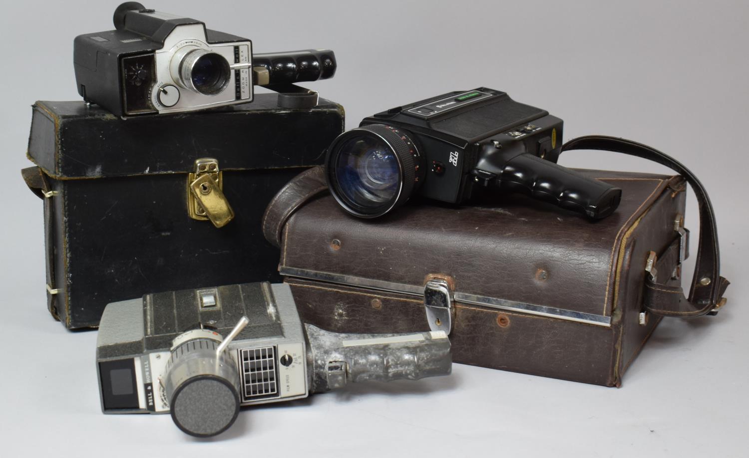 A Collection of three Vintage Bell and Howell 8mm Cine Cameras, In need of Some Restoration