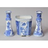 A Pair of Transfer Printed Oriental Style Blue and White Candlesticks and a Planter