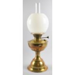 An Edwardian Brass Oil Lamp with Opaque Shade and Plain Chimney, 54cm high