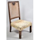 An Edwardian Cane Backed, Tapestry Upholstered Nursing Chair