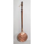 A Copper Bed Warming Pan with Turned Wooden Handle