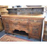 An Edwardian Carved Oak Sideboard/Buffet with Three Drawers Over Cupboard base, Raised Galleried