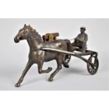 A Novelty Lighter In the Form of a Bronze Effect Trotting Horse and Sulky, One Wheel AF (We are