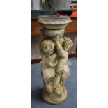 A Reconstituted Garden Figural Sundial, Cherub Supporting Vase, 61cm high