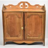 A Wall Hanging Galleried Shelved Cabinet with Panelled Doors, 57cm Wide