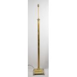 A Brass Standard Lamp in the Form of Ribbed Corinthian Column on Stepped Square Base with Four