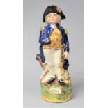A Staffordshire Character Jug Modelled as Armorial Lord Nelson Standing Beside Cannon and Holding