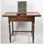 An Edwardian Oak Dressing Table with Sliding Top, Opening to Reveal Hinged Mirror on Reeded