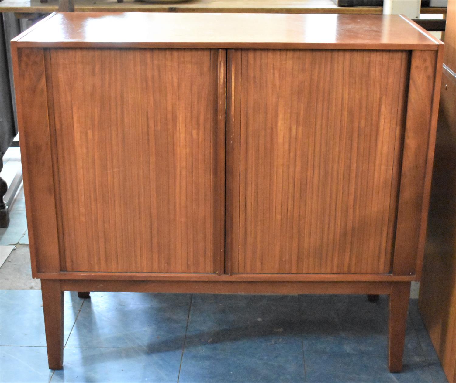 A Tambour Fronted TV Cabinet on Unrelated Stand