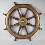 A Vintage Brass Mounted Ships Wheel, Inscribed with the War Department Crows Foot and Numbered