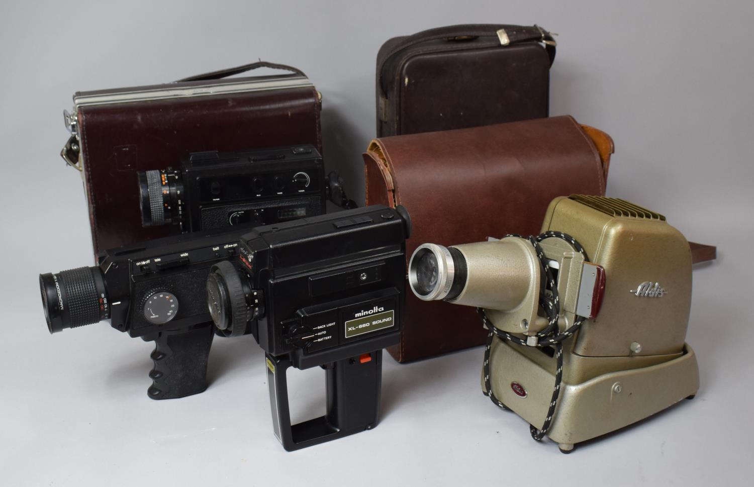 A Collection of Two Bolex and One Minolta 8mm Cine Cameras Together with an Aldis Slide Projector,