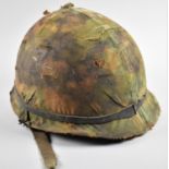 An American Type 1 Steel Helmet with Camouflage Cover