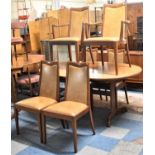An Oval G Plan Extending Dining Table and Set of Six Leather Upholstered Chairs to Include Two