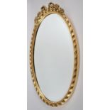 A Modern Gilt Framed Oval Wall Mirror, 63x36cm