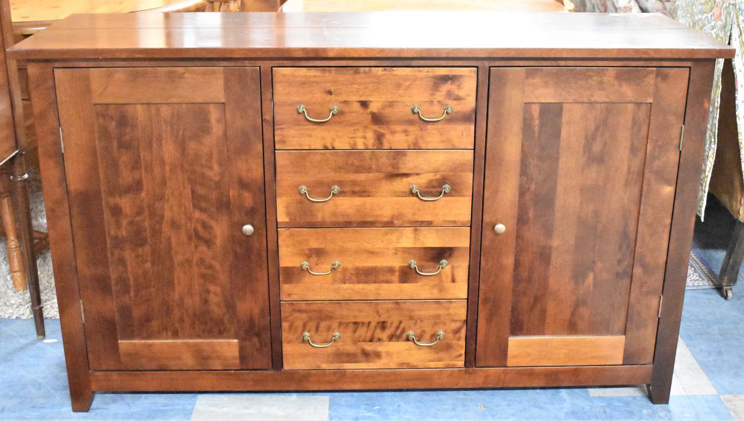 A Modern Next Sideboard with Four Centre Drawers Flanked by Panelled Doors to Two Shelved Cupboards,