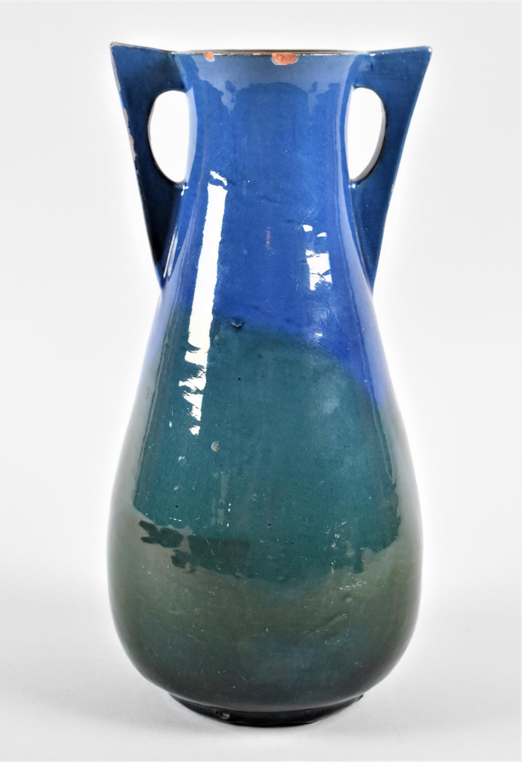 A Blue and Green Glazed Two Handled Terracotta Vase by CH Brannam, the Base Stamped "Made for