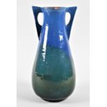 A Blue and Green Glazed Two Handled Terracotta Vase by CH Brannam, the Base Stamped "Made for