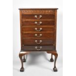 An Edwardian Mahogany Six Drawer Music Chest on Short Cabriole Supports with Claw and Ball Feet,