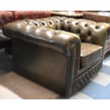 A Late 20th Buttoned Leather Upholstered Arm Chair