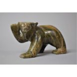 A Canadian Green Stone Inuk Carving of a Bear Cub with Raised Paw, 12cm Long