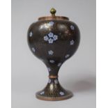 A Cloisonné Vase and Cover Decorated with Blue Flowers on Black Ground, 22cm high