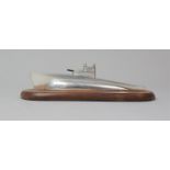 A Mid 20th Century Desk Top Aluminium Novelty Paperweight In the Form of a Submarine, Set on Oval