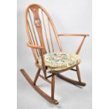 An Ercol Rocking Chair with Swan Splat