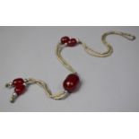 A Continental White Metal and Cherry Amber Bakelite Necklace