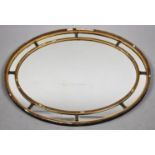 A Mid 20th Century Oval Gilt Framed Wall Mirror, in Need of Some Restoration, 77cm Wide