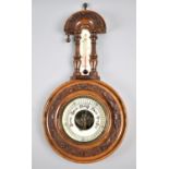 A Late Victorian Aneroid Wheel Barometer with Thermometer, Carved Oak Leaf Decoration, 40cm high