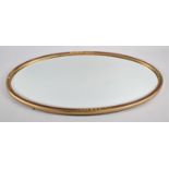 A Modern Oval Wall Mirror with Bevelled Glass, 69x41cm