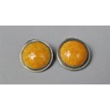 A Pair of Ruskin Style Arts and Crafts Clip on earrings with Pewter Surrounds and Egg Yolk