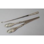 A Silver Handled Glove Stretcher, Birmingham 1912 Together with a Victorian Silver Handled Button