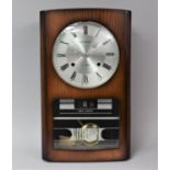 A Mid 20th Century President Day Date Wall Clock with 31 Day Movement, 47cm high