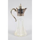 A Silver Plate Topped Moulded Glass Claret Jug, 31cm high