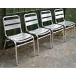 A Set Four Stacking Metal Ladder Back Patio Chairs
