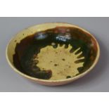 A Treacle Glazed Terracotta Bowl, 25cm Diameter