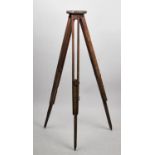 A Vintage Wooden Theodolite or Level Tripod with Adjustable Supports and Circular Top