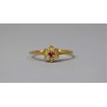 A Gold Plated Ladies Dress Ring with Ruby Stone to Centre of a White CZ Cluster, Size T