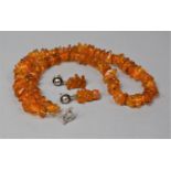 An Amber Chip Necklace with Silver Clasp and Pair of Amber Drop Earrings on Silver Posts