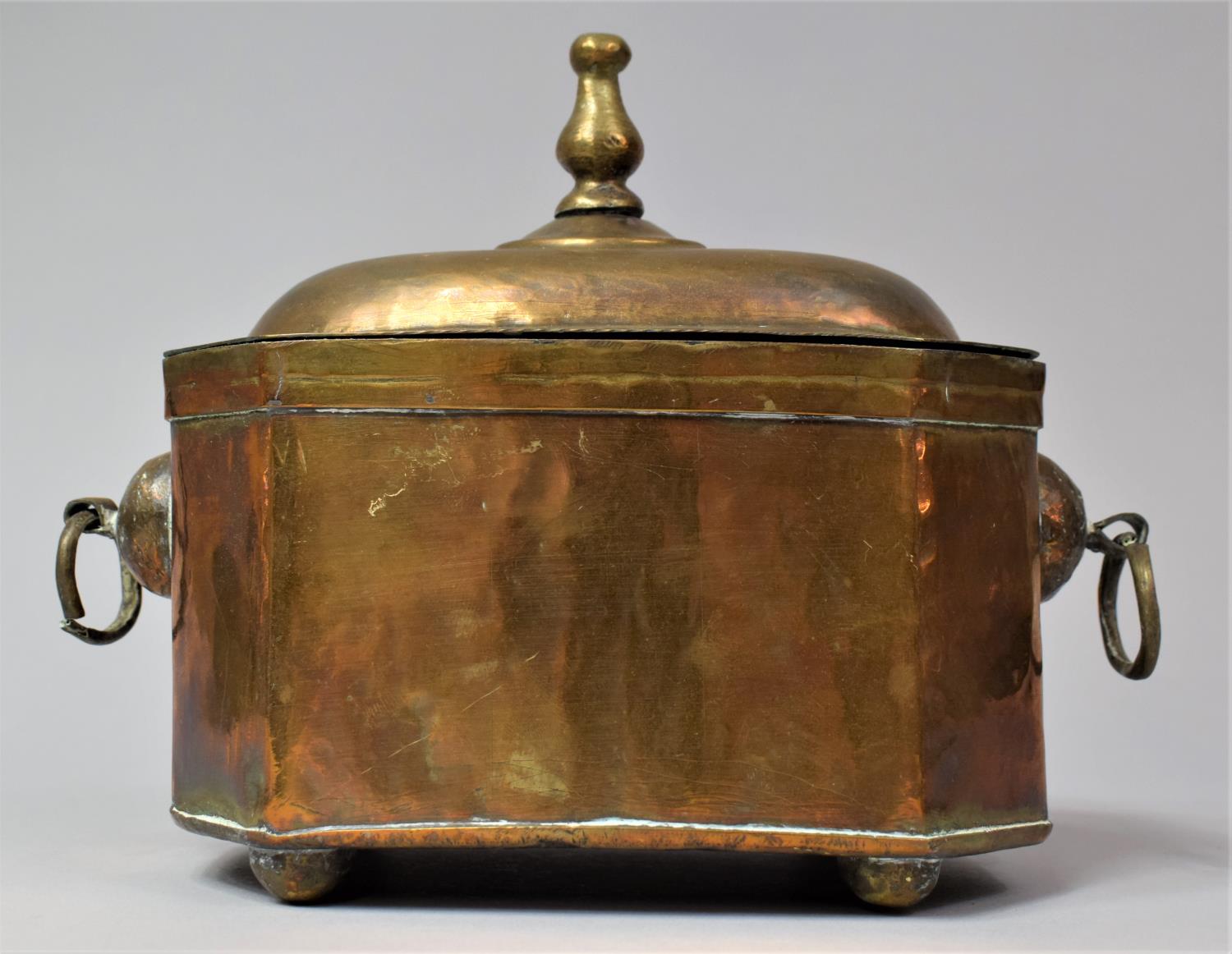 A Dutch Indonesian Colonial Brass Tea Caddy of Sarcophagus Form, with Two Ring Handles and Hinged