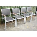 A Set of Four Modern Metal Framed Woven Stacking Patio Chairs