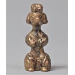 A Small Bronze Study of a Seated Poodle, 4cm high