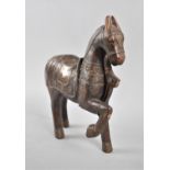 A Brass Mounted Persian or North Indian Carved Study of a War Horse, 25cm High