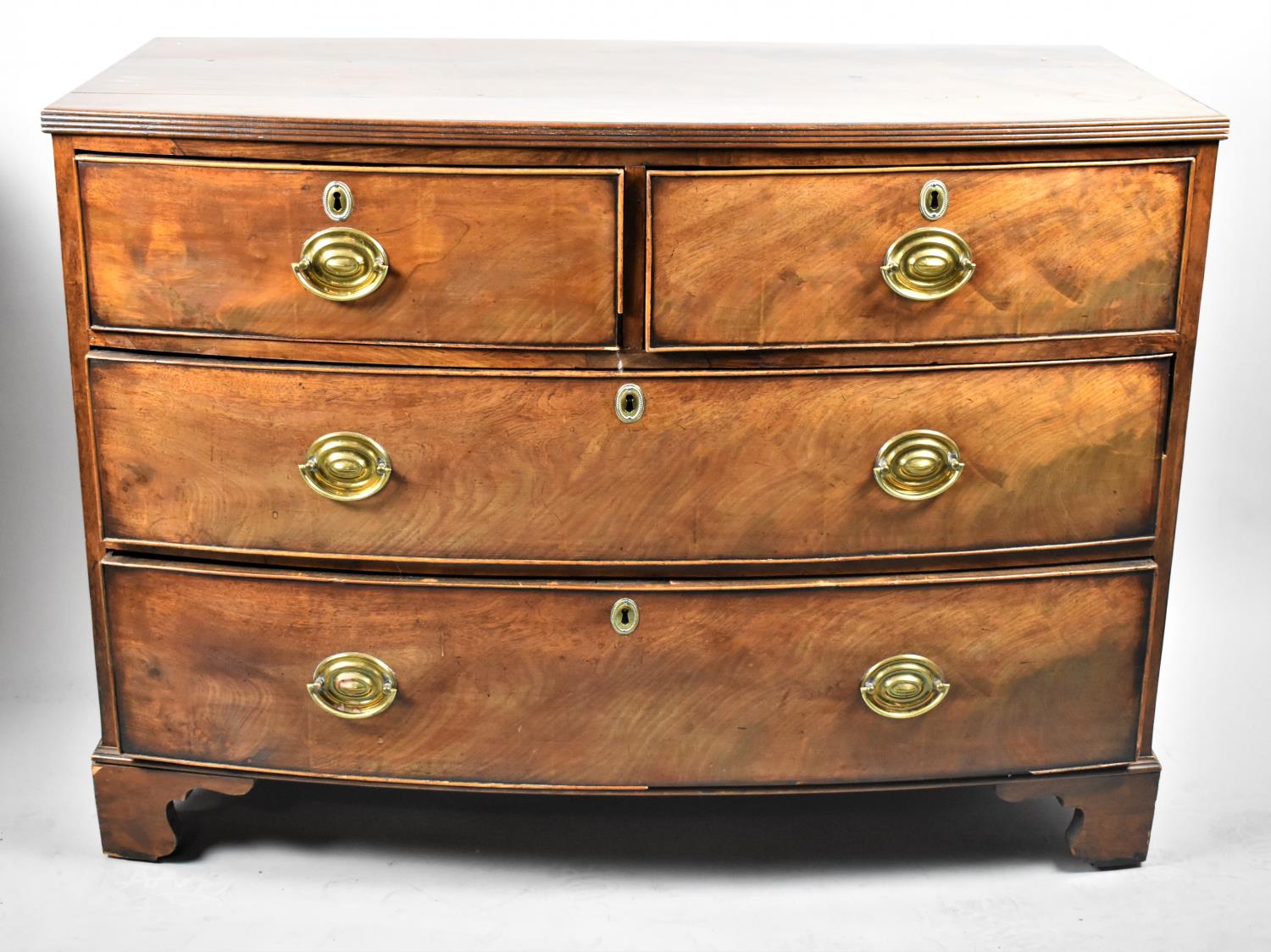 A 19th Century Bow Fronted Mahogany Chest of Two Short and Two Long Drawers on Bracket Feet, Oval