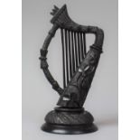 A Large Irish Carved Bog Oak Item in the Form of a Harp, 18cm high