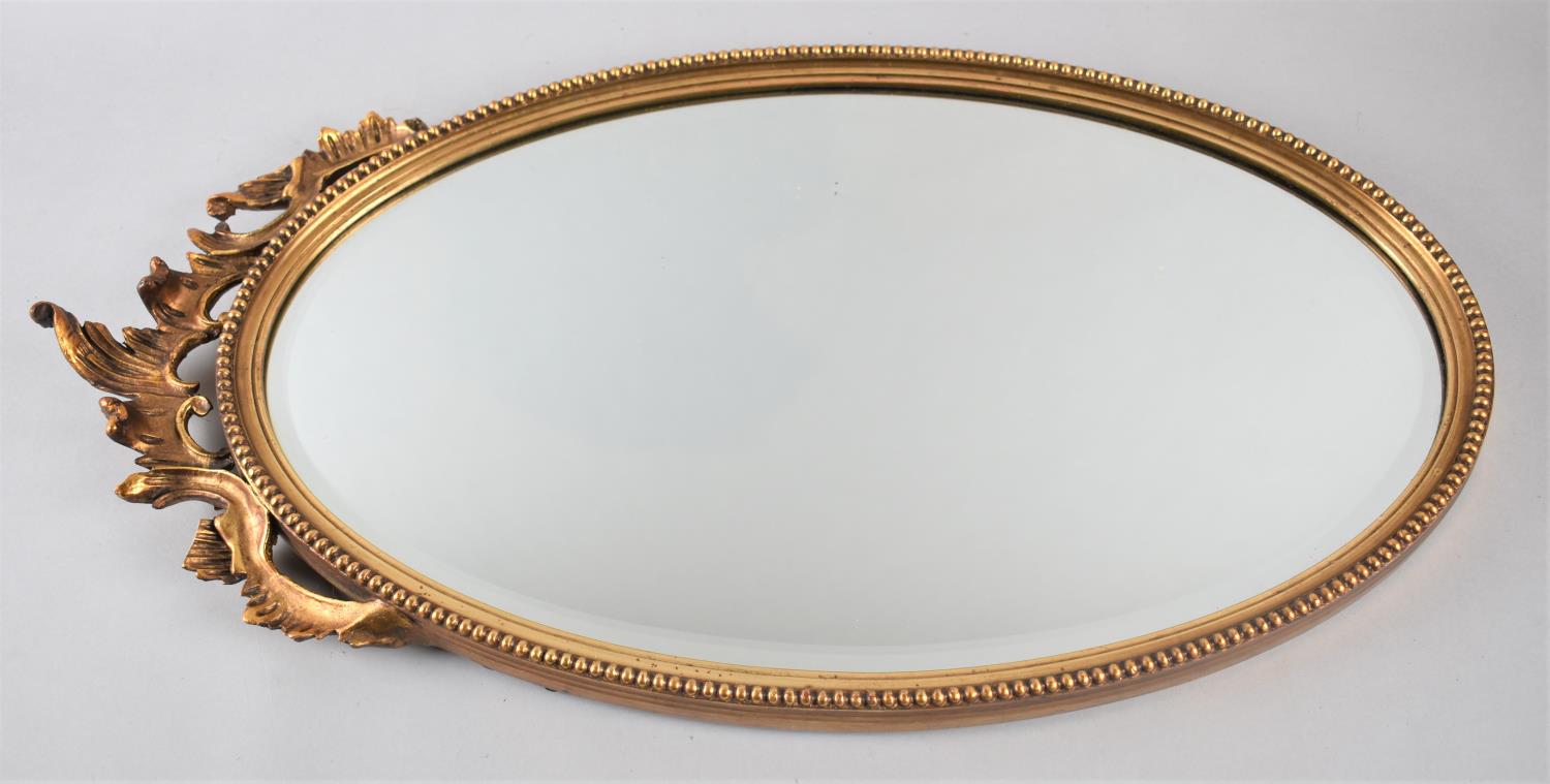 A Mid 20th Century Oval Gilt Framed Bevel Edged Wall Mirror, 66x35cm