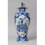A 19th Century Chinese Blue and White 'Hundred Antiques' Lidded Baluster Vase, The Body Decorated